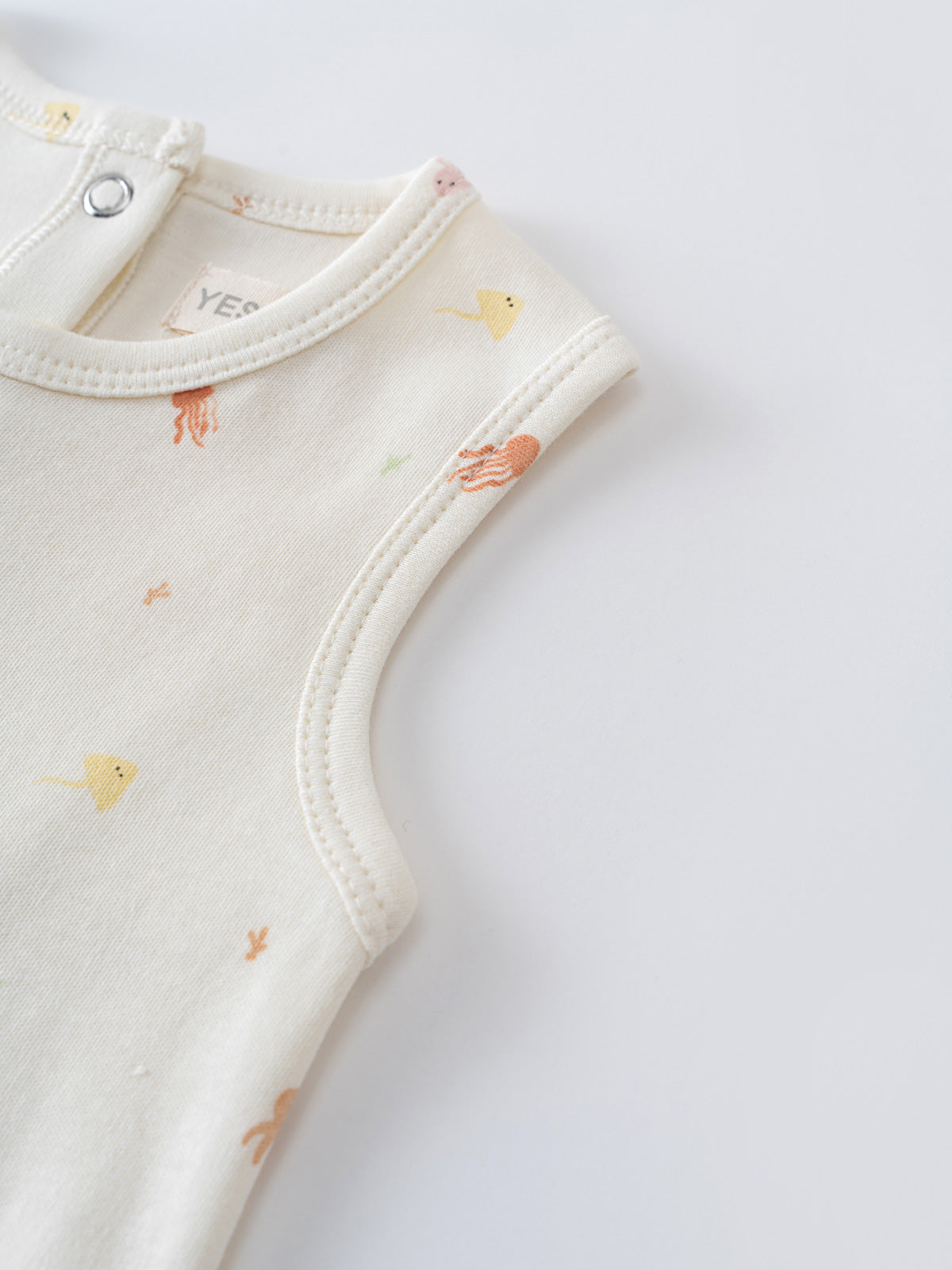 Close-up of cream sleeveless baby tee with embroidered sea creatures Andi Sleeveless Tee - Ocean Buddies Baby girl