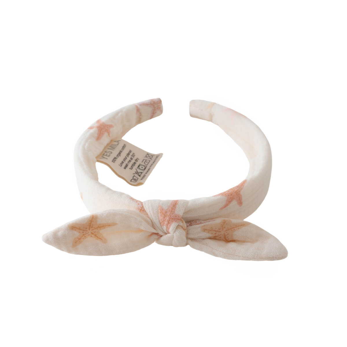 White fabric headband with starfish pattern and knotted bow detail Aria Headband - Starfish Girls