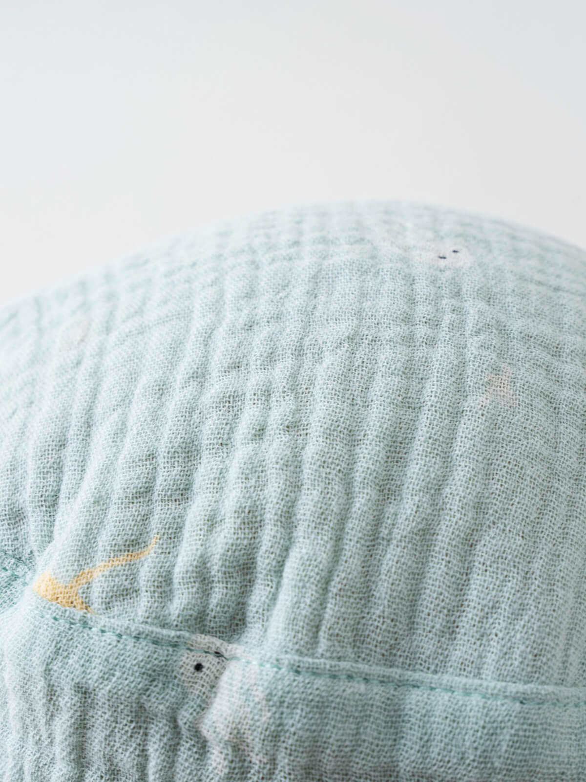 Close-up of light blue textured fabric hat with small embroidered details Baby Bucket Hat - Sea Friends Baby boy