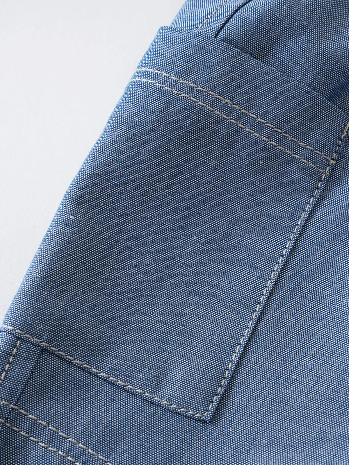 Close-up of blue chambray fabric with white topstitching detail Chambray Shorts - Blue Chambray Baby boy
