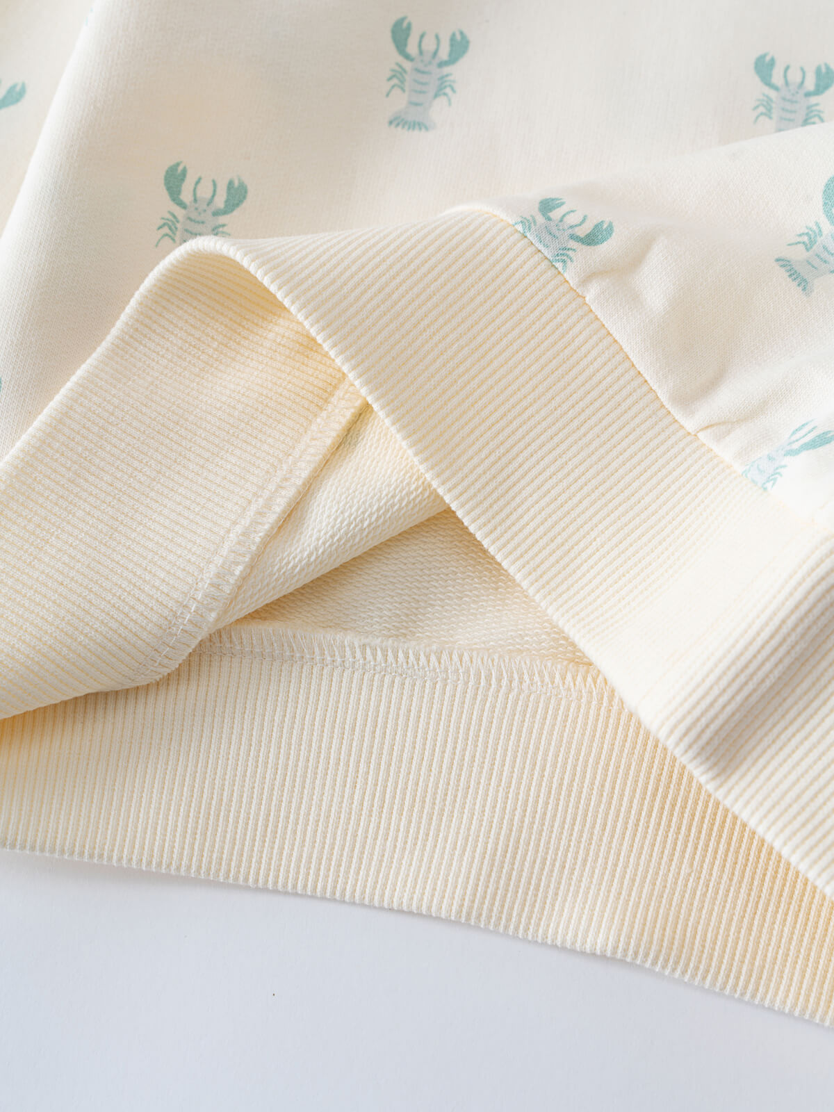 Yellow striped fabric folded over white fabric with blue lobster print Liam Sweatshirt - Charlie's Friends Baby boy