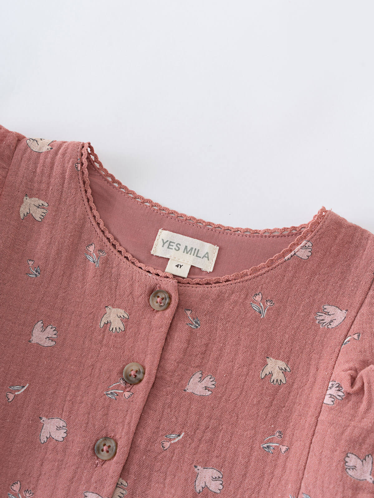 Pink children's dress with animal prints and 'YES MILA' label on a white background Printed Woven Dress - Bird And Blossom Rosehip Girls