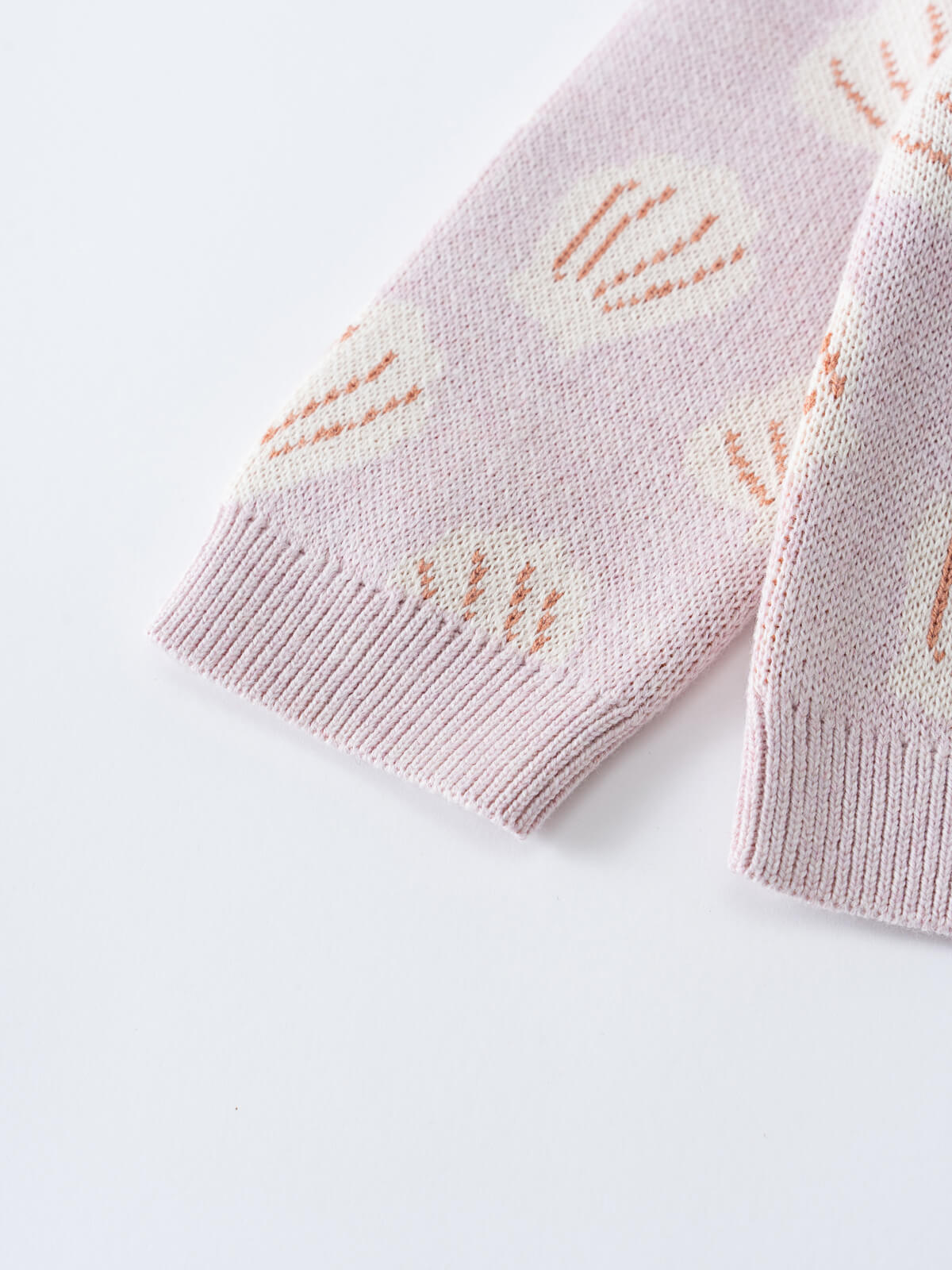 Close-up of a lilac knitted cardigan with shell pattern details Shelly Cardigan - Candy Floss Shells Baby girl