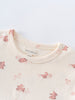Close-up of cream-colored baby shirt collar with pink rabbit print pattern Baby Printed Short Sleeve Tee - Meadow Friends Ecru Baby girl