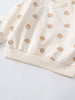 Close-up of cream sweatshirt with brown bear print and ribbed trim Baby Printed Sweatshirt - Cosy Bear Ecru Baby boy