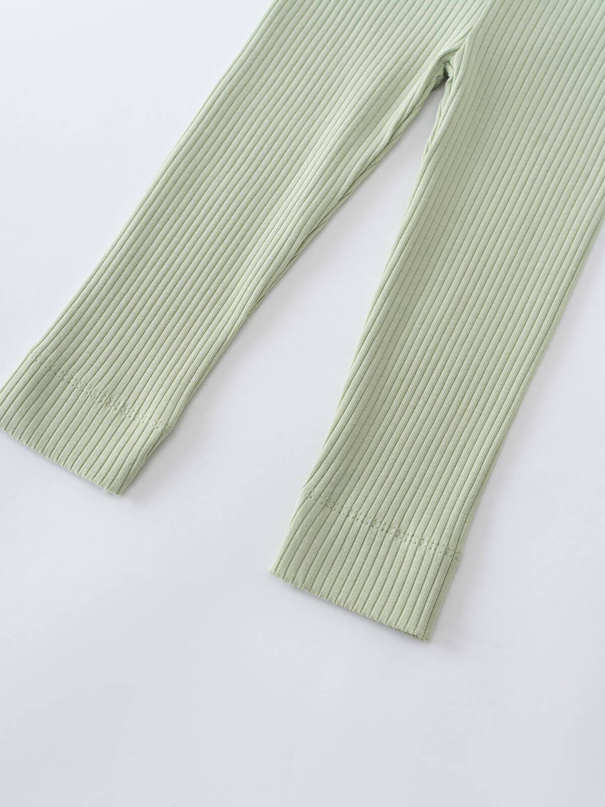 Pale green ribbed leggings laid flat on white surface Baby Ribbed Leggings - Sage Baby boy