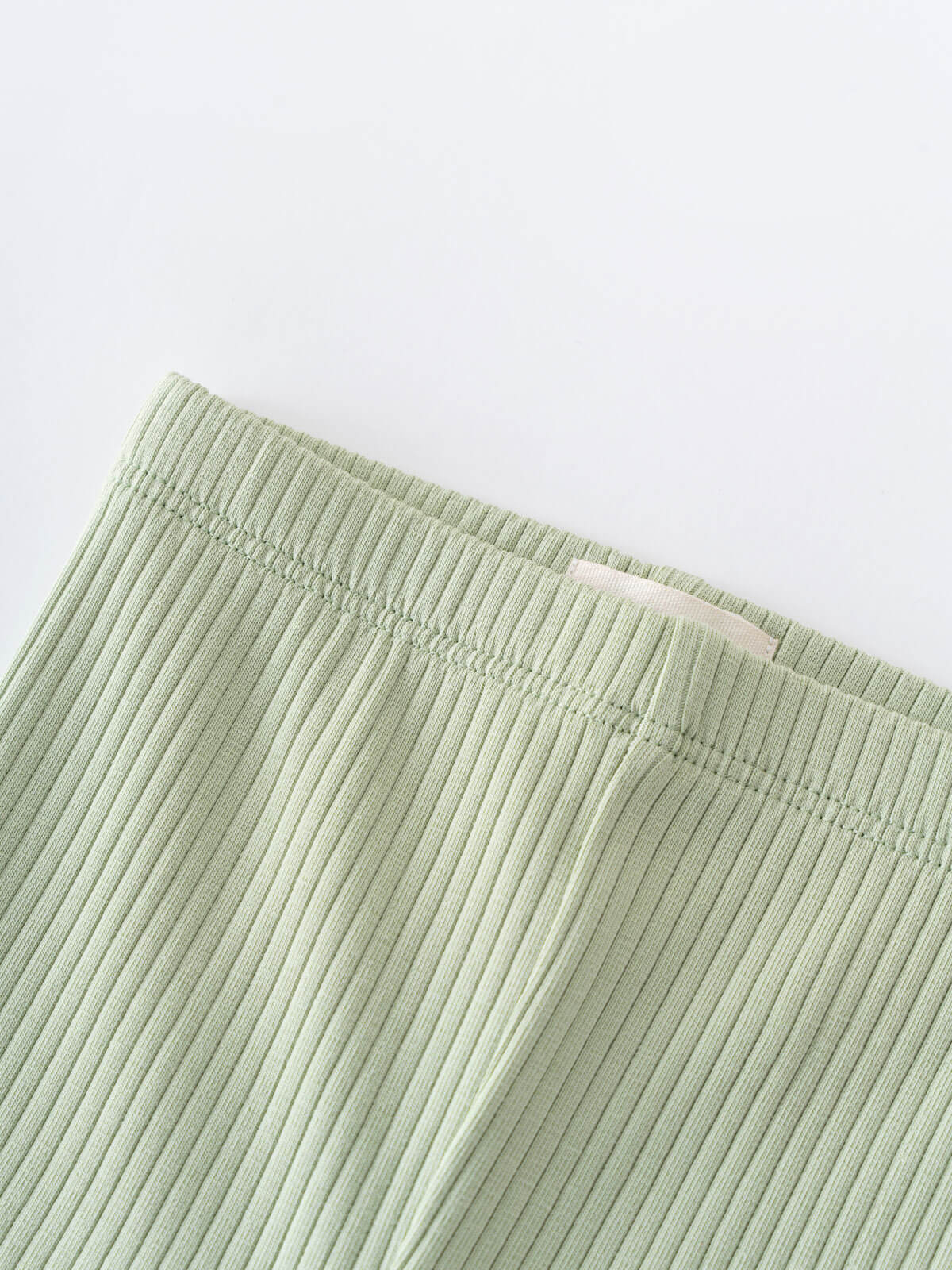 Close-up of sage green ribbed fabric with elastic waistband detail Baby Ribbed Leggings - Sage Baby boy