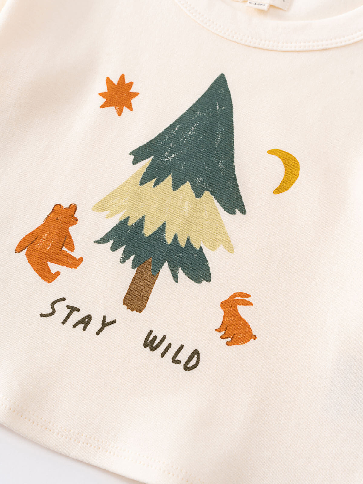 Children's t-shirt with forest-themed design featuring a tree, bear, and rabbit on a white background. Baby Feature Print Long Sleeve Tee - Stay Wild Baby boy
