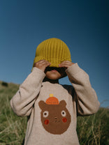 Child pulling yellow ribbed beanie over face wearing bear sweater outdoors Ribbed Beanie - Golden Pear Boys