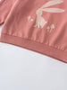 Close-up of pink sweatshirt hem with white rabbit and mushroom print Feature Print Sweatshirt - Forest Gathering Girls