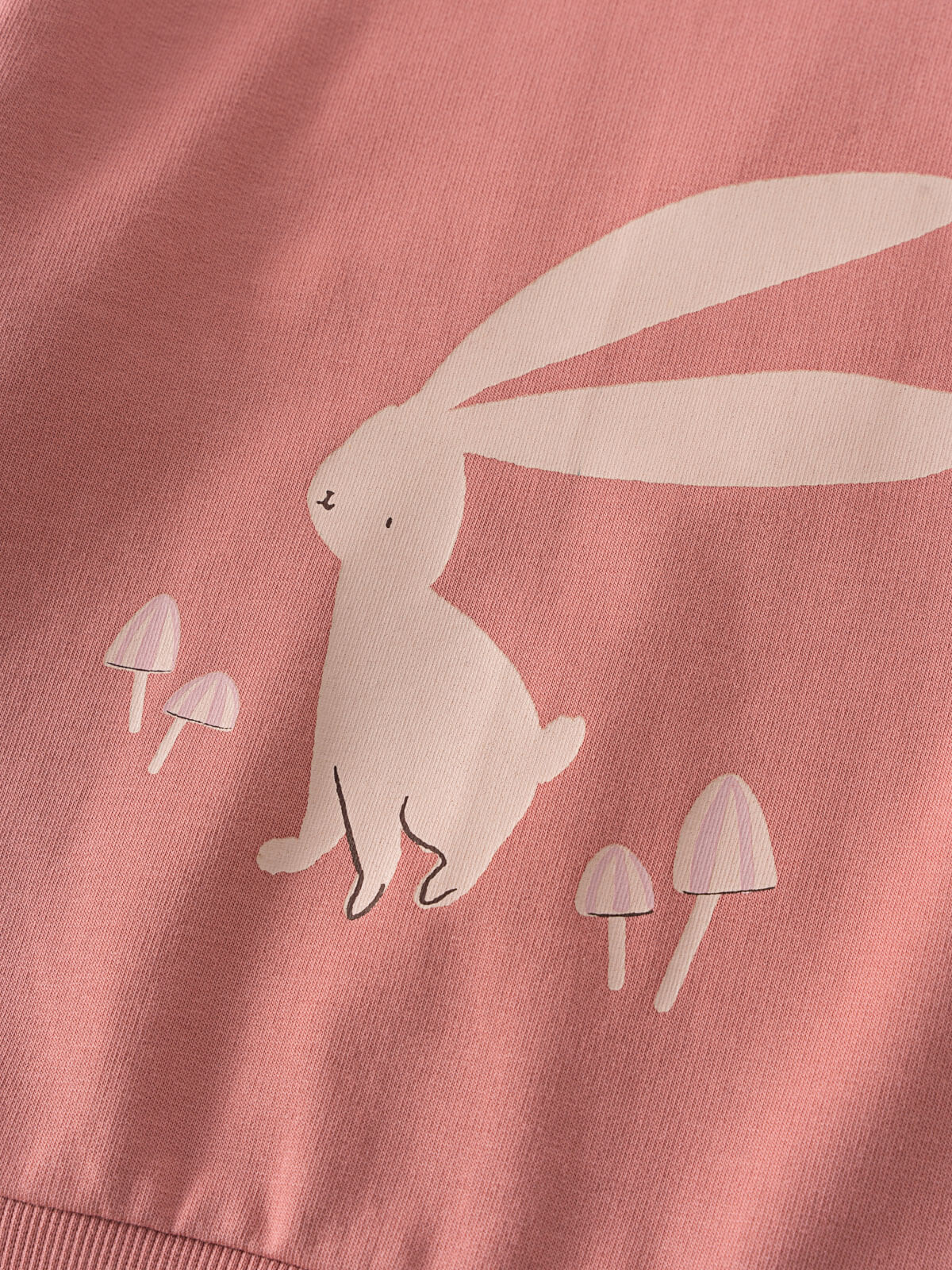 Close-up of a pink sweatshirt with a white rabbit and mushroom design Feature Print Sweatshirt - Forest Gathering Girls