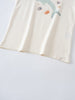 Close-up of cream-colored fabric with ocean-themed prints including shells and starfish Feature Print Short Sleeve Tee - Dolphin Short Sleeve Tee Shirt - Dolphin Girls