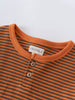 Close-up of orange and brown striped shirt with button placket Henley Long Sleeve Tee - Pumpkin Boys