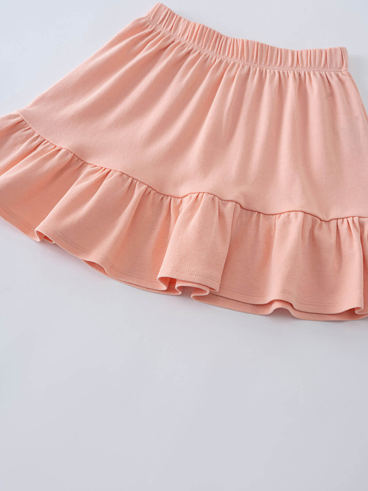 Pink tiered skirt with elastic waistband and ruffled hem detail Jersey Skirt - Mallow Girls