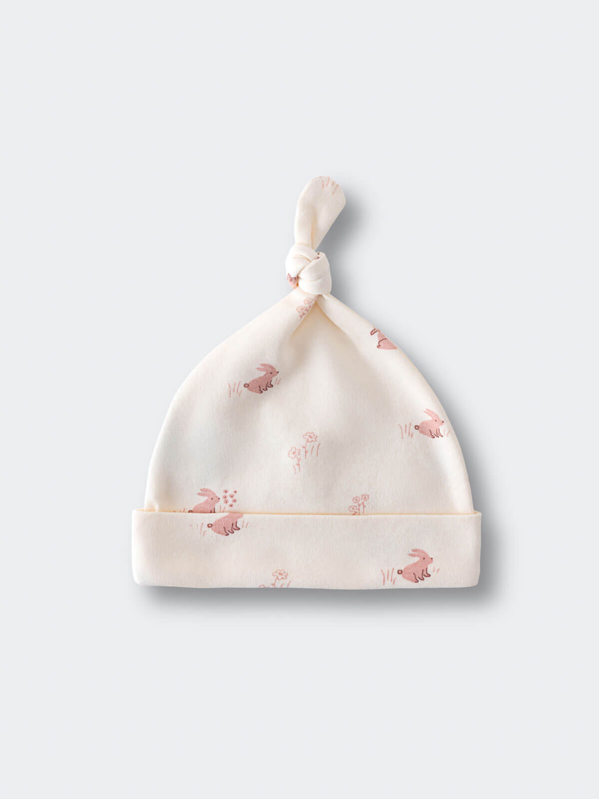 Cream-colored baby hat with pink animal print and knotted top Knot Hat - Meadow Friends Ecru Baby girl