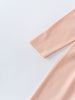 Close-up of peach-colored long sleeve jersey fabric with hemmed cuff detail Long Sleeve Jersey Dress - Mallow Girls