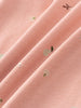 Close-up of pink fabric with small embroidered leaf and floral details Long Sleeve Bodysuit - Autumn Harvest Rosehip Baby girl
