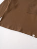 Close-up of brown long sleeve shirt showing chest pocket and hem detail Long Sleeve Tee - Spruce Boys