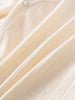 Close-up of cream-colored fabric with pointelle detail and button fastening Pointelle Crossover Bodysuit - Ecru Baby boy