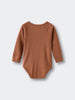 Brown ribbed pointelle knit bodysuit laid flat on light background Pointelle Crossover Bodysuit - Russet Baby boy
