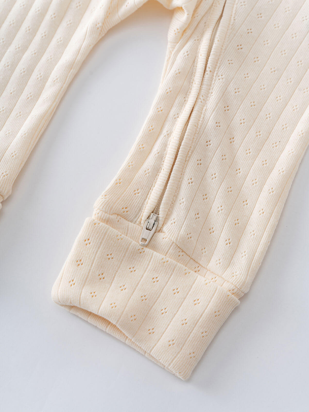 Beige baby romper with a zipper on a white background Pointelle Long Sleeve One Piece - Ecru Baby boy