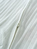 Close-up of a textured fabric with a zipper running through it. Pointelle Long Sleeve One Piece - Sea Foam Baby boy