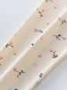 Close-up of cream fabric with pink floral and green leaf print Printed Leggings - Wild Meadow Ecru Girls