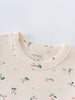 Close-up of cream-colored collar with small pink floral print pattern Printed Short Sleeve Tee - Wild Meadow Ecru Girls