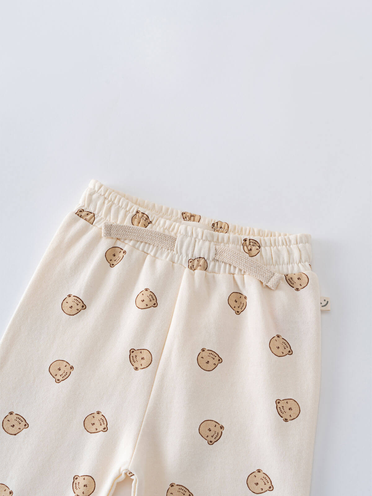 Cream colored sweatpants with brown bear face print pattern Printed Sweatpants - Cosy Bear Ecru Baby boy