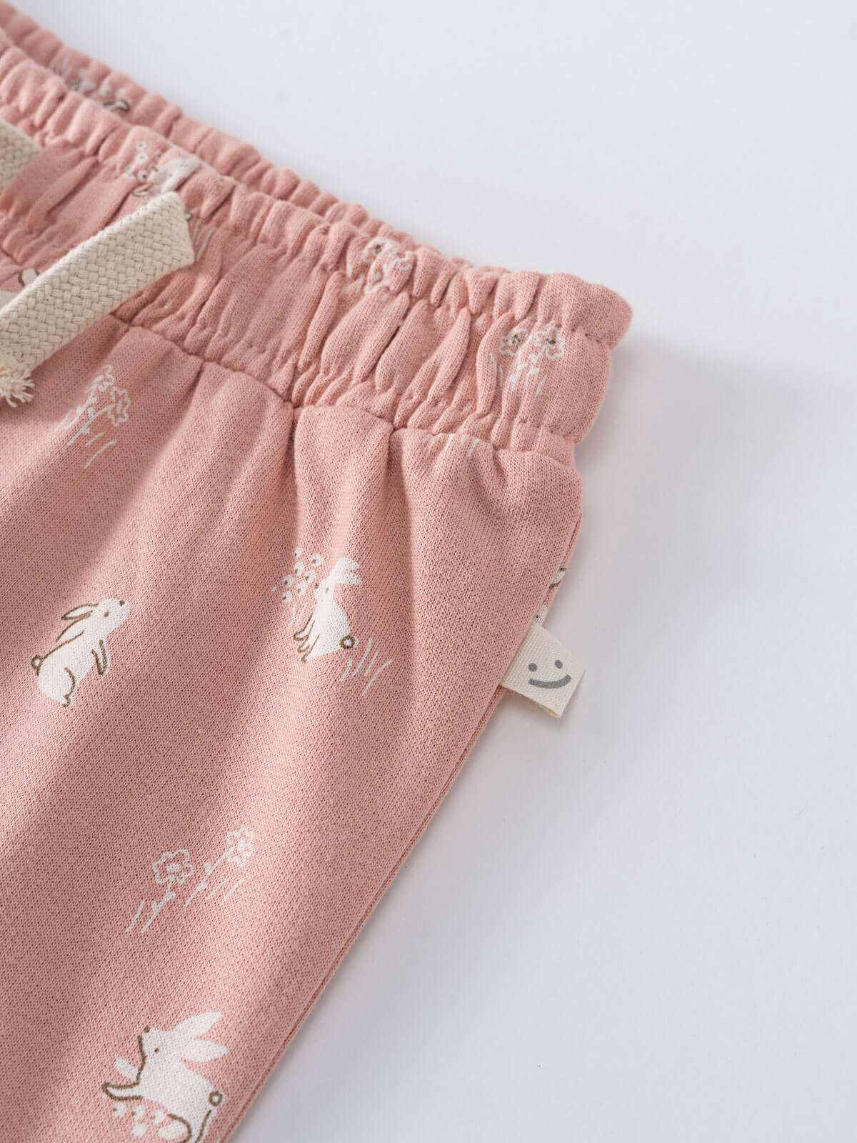 Close-up of pink sweatpants waistband with white animal print pattern Printed Sweatpants - Meadow Friends Blush Baby girl
