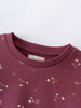 Close-up of a plum-colored sweatshirt with small floral print pattern Printed Sweatshirt - Wild Meadow Plum Jam Girls