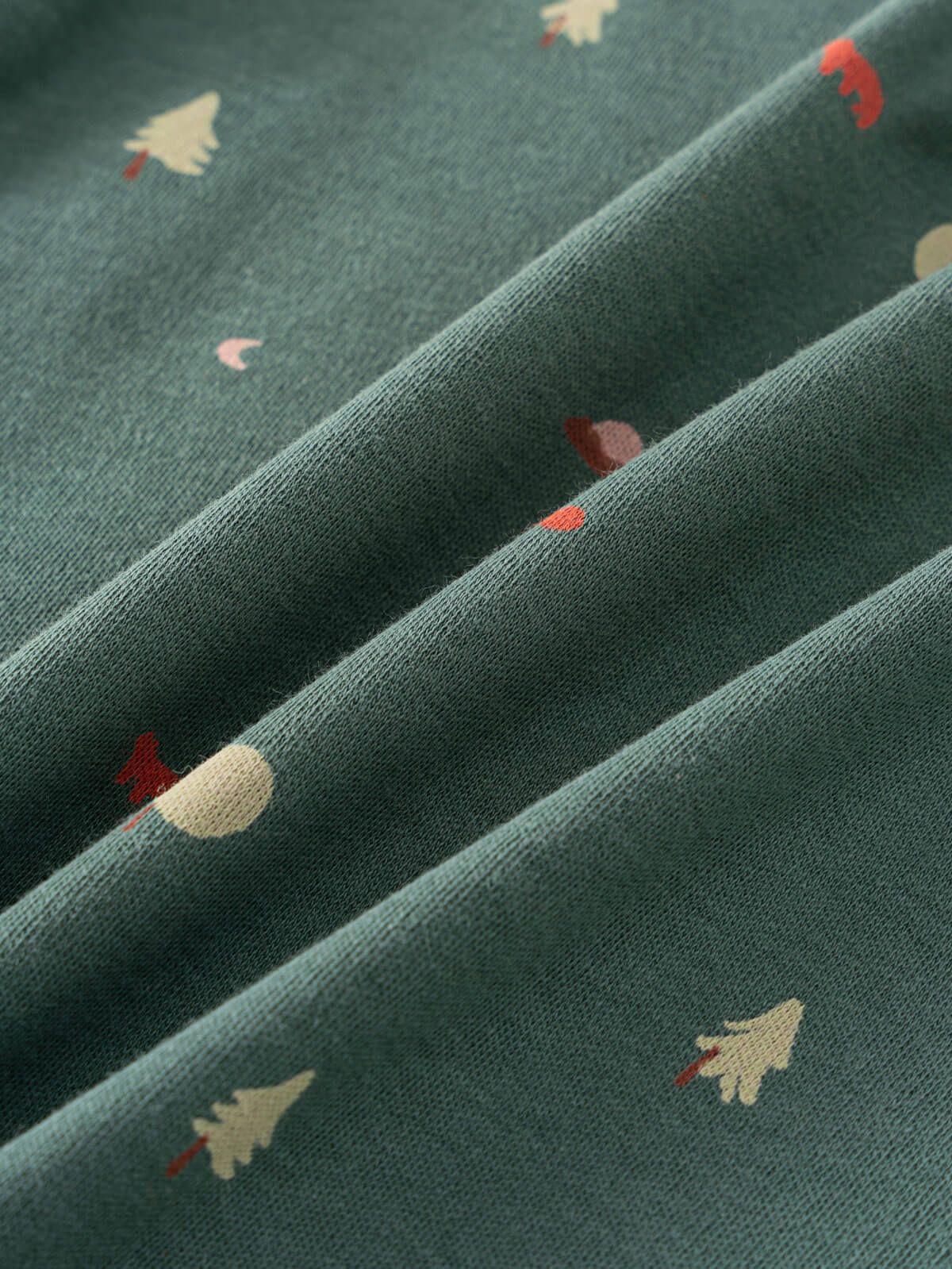 Close-up of green fabric with small printed trees and roosters pattern Baby Printed Short Sleeve Tee - Mountain View Ecru Baby boy