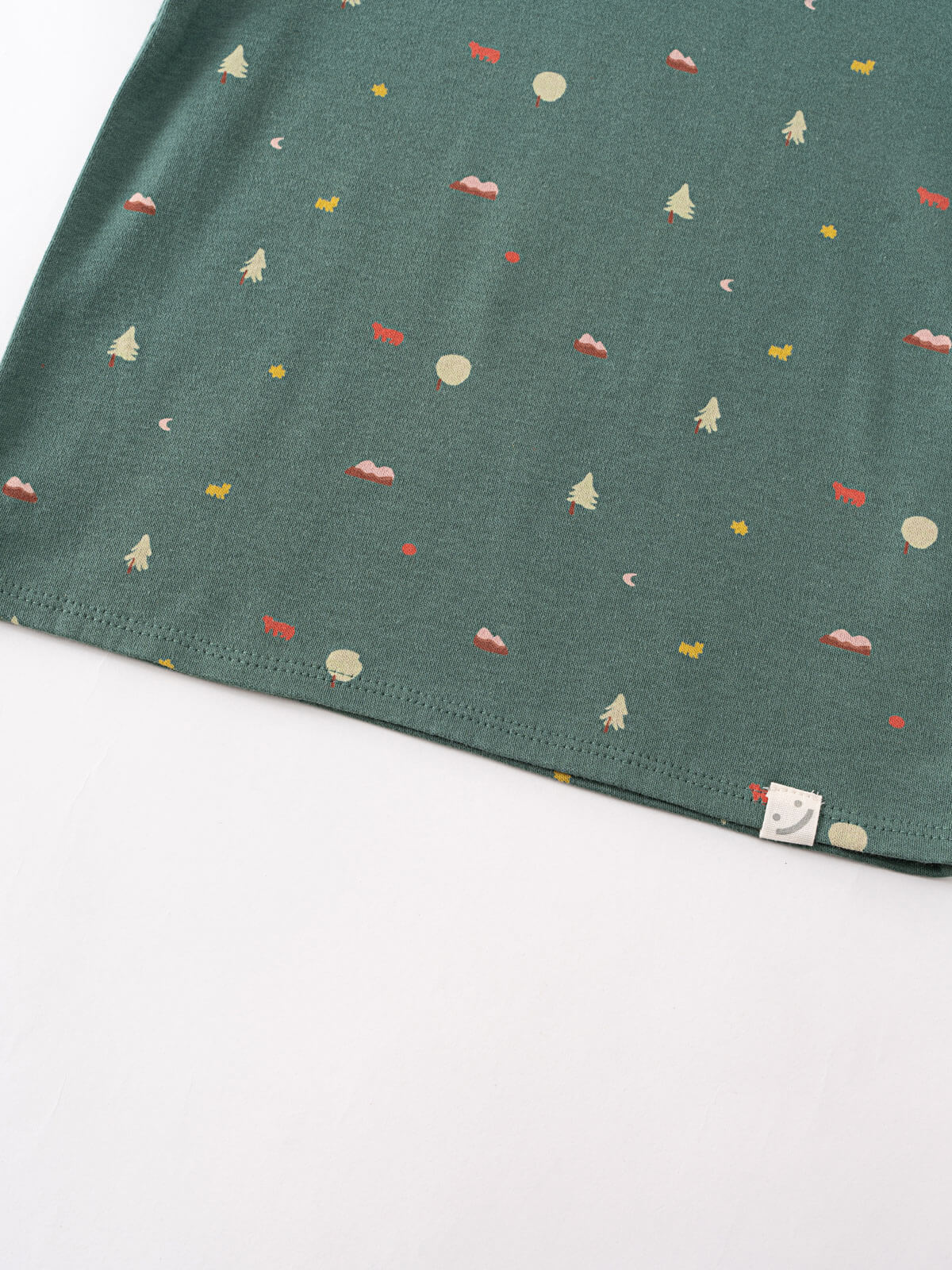 Green fabric with small printed trees, clouds, and nature motifs Baby Printed Short Sleeve Tee - Mountain View Ecru Baby boy