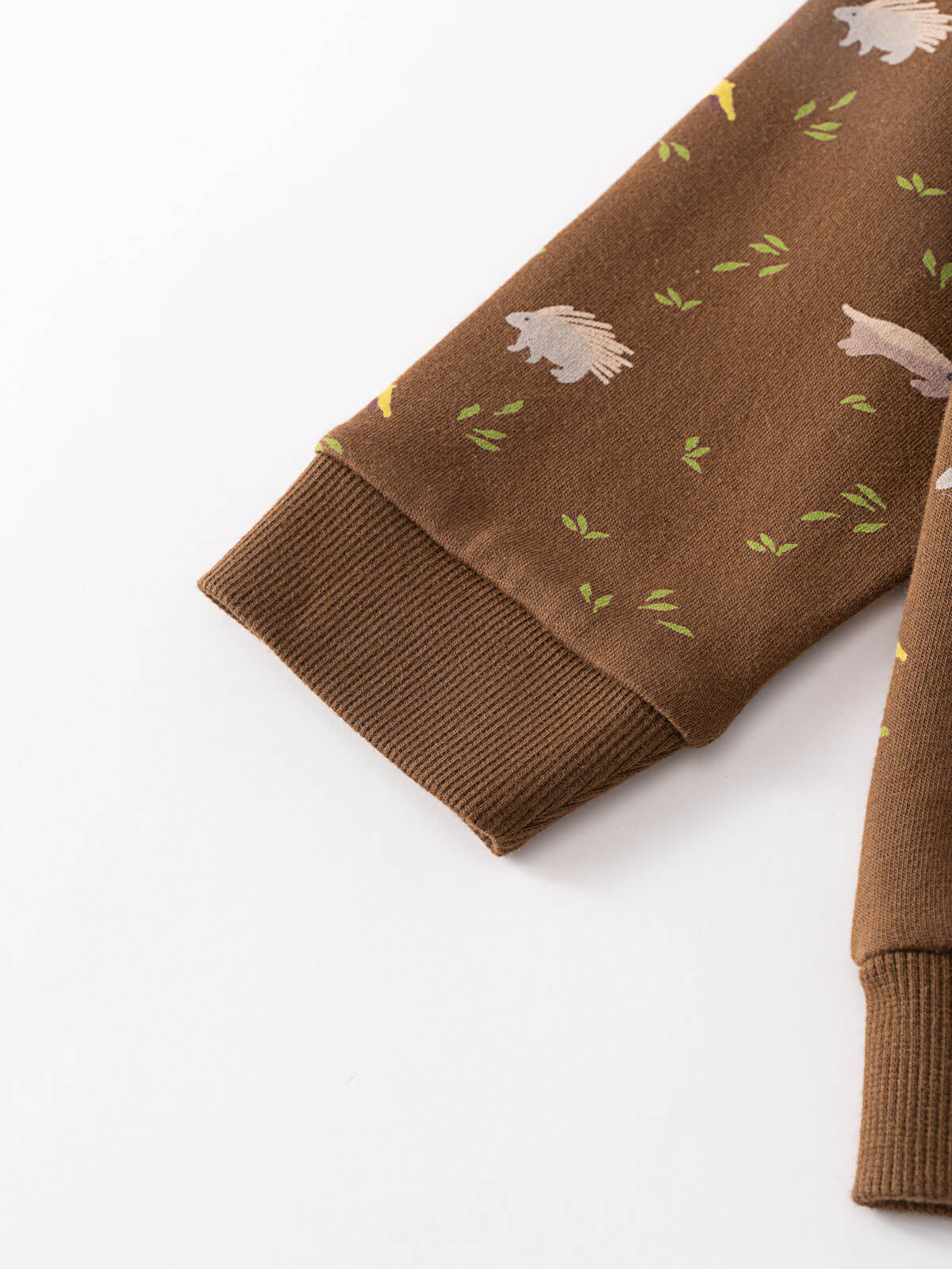 Close-up of brown sweatshirt cuff with bird and leaf pattern Printed Sweatshirt - Wild Friends Spruce Baby boy