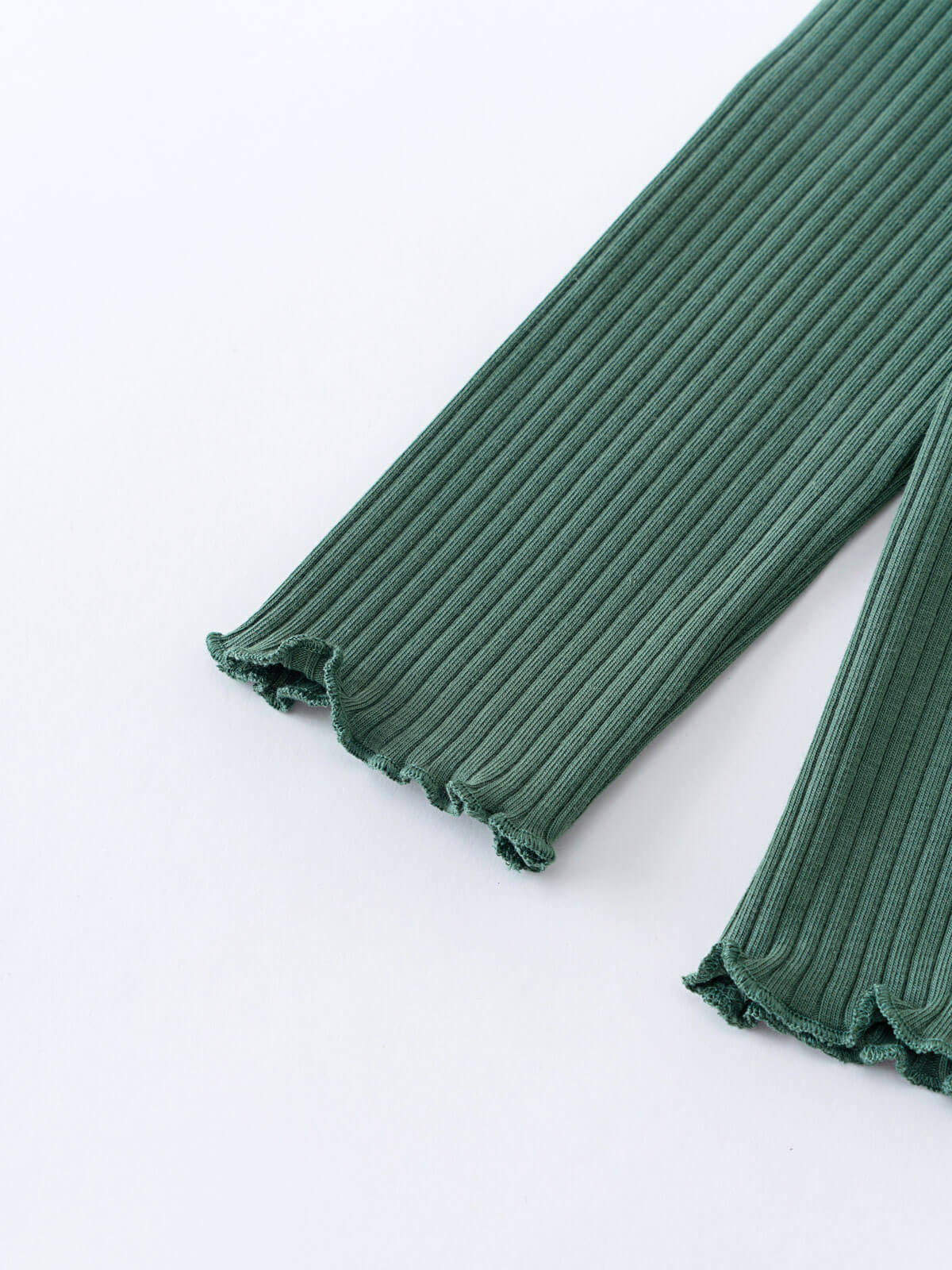 Close-up of green ribbed fabric sleeves with ruffled cuffs on white background Ribbed Long Sleeve Tee - Balsam Girls