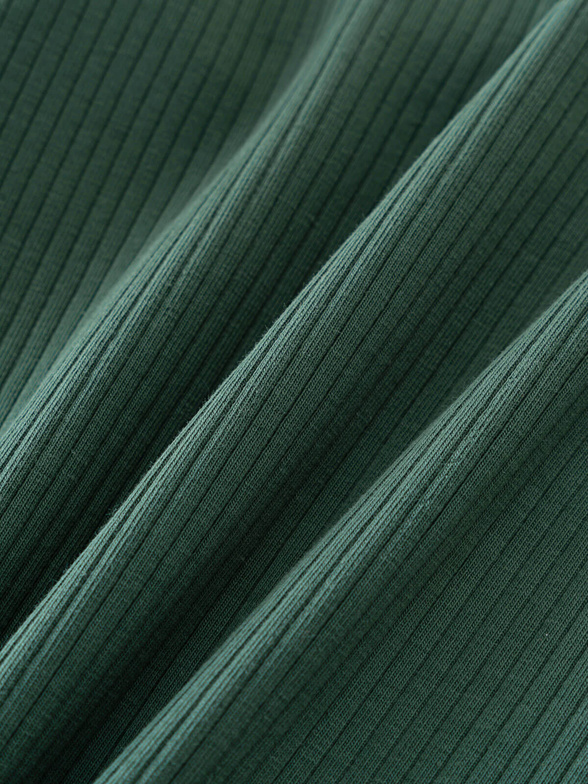 Close-up of ribbed green fabric with diagonal folds and texture Ribbed Long Sleeve Tee - Balsam Girls