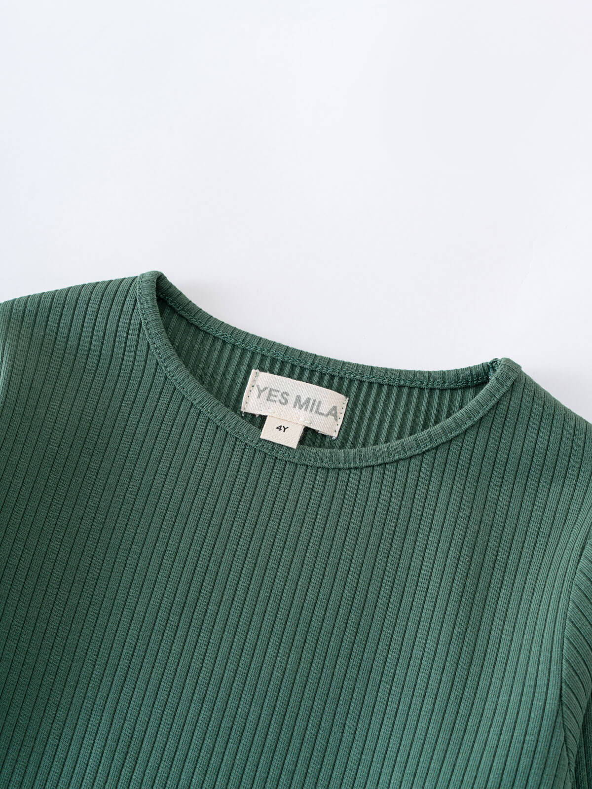 Close-up of a green ribbed long sleeve shirt neckline with label Ribbed Long Sleeve Tee - Balsam Girls