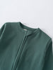Close-up of a teal ribbed fabric garment showing neckline and shoulder detail Ribbed Long Sleeve One Piece - Balsam Baby boy