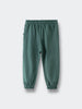 Green sweatpants with elastic waistband and cuffed ankles laid flat Sweatpants - Balsam Boys