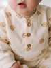 Baby wearing cream onesie with bear print and wooden buttons Sweatshirt Onesie - Cosy Bear Ecru Baby boy