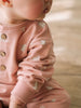 Baby wearing a pink onesie with animal print and wooden buttons Sweatshirt Onesie - Meadow Friends Blush Baby girl