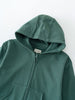 Close-up of a dark green hooded sweatshirt with zipper and front pocket Zip Hoodie - Balsam Boys