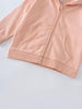 Close-up of a peach-colored zip hoodie showing pockets and ribbed hem Zip Hoodie - Mallow Boys