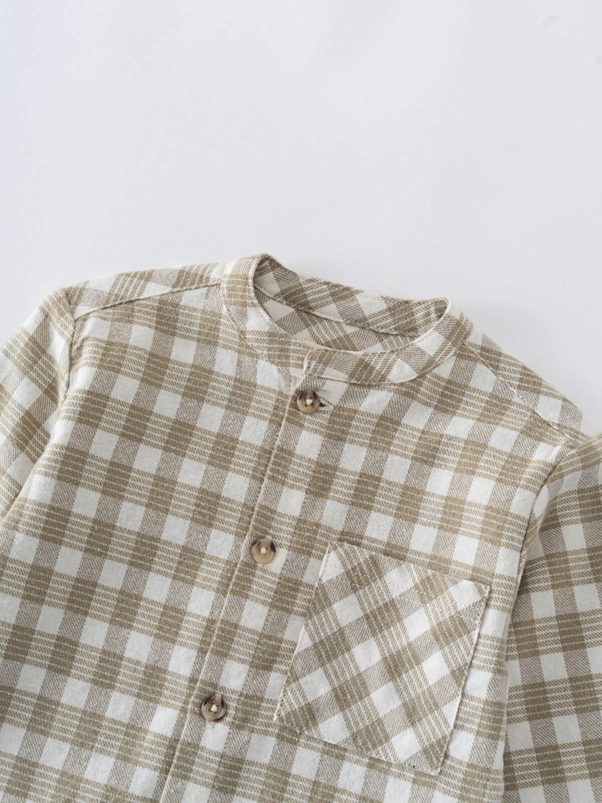 Close-up of a brown and white checkered shirt on a light gray background Baby Check Shirt - Woven Check Baby boy