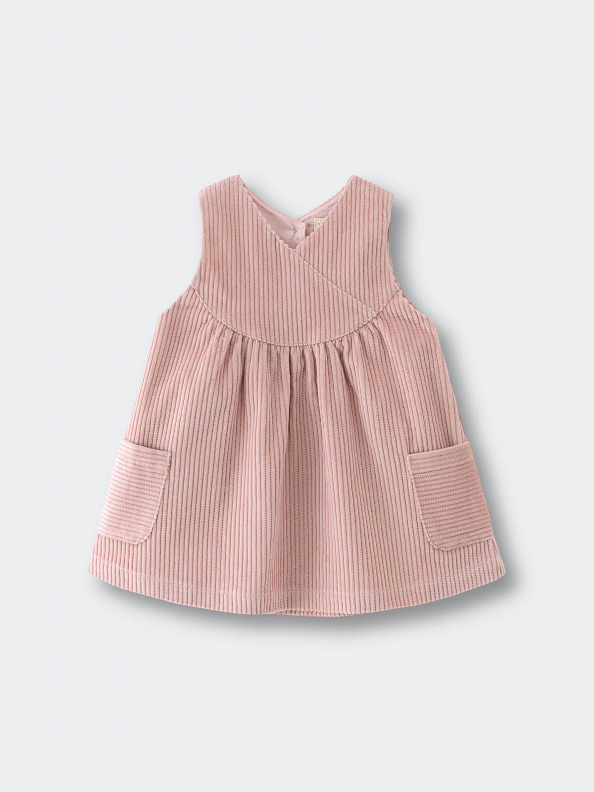 Pink corduroy dress with pockets on a light gray background Baby Corduroy Dress - Blush Baby girl
