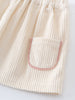 Close-up of a corduroy skirt with a pocket on a light background Baby Corduroy Skirt - Ecru Baby girl