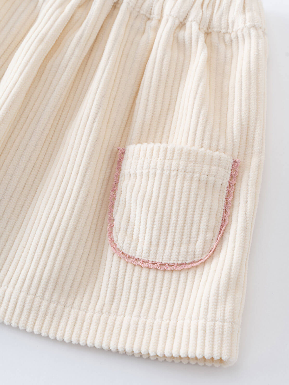 Close-up of a corduroy skirt with a pocket on a light background Baby Corduroy Skirt - Ecru Baby girl