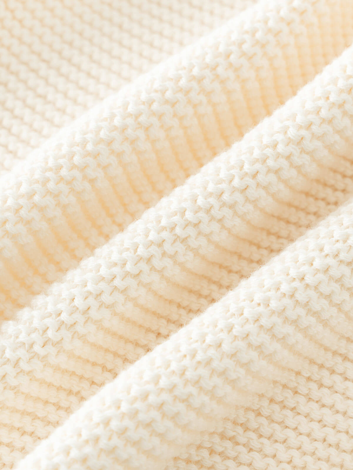 Close-up of beige knitted cotton fabric texture Baby Cotton Cardigan - Ecru Baby boy