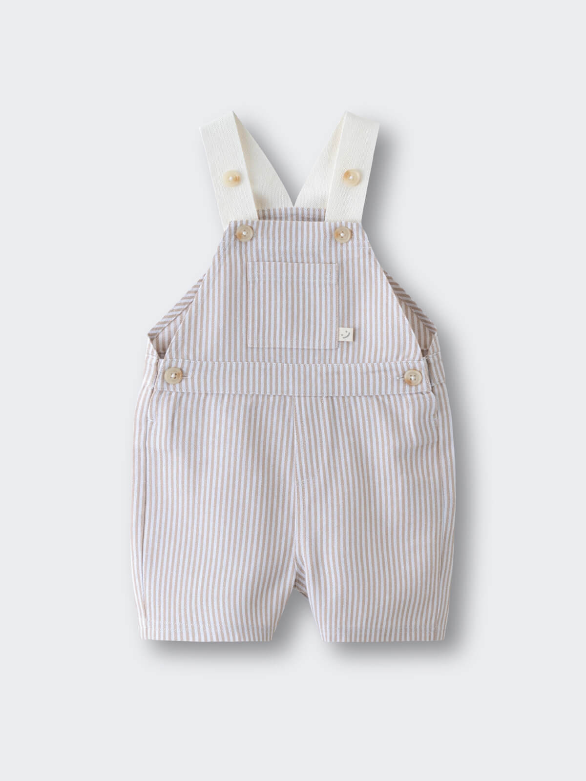 Striped baby overalls with cream straps and button details laid flat Baby Dungarees - Sand Stripe Baby boy