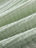 Close-up of light green and white striped fabric with soft texture Muslin Shorts - Light Green Stripe Baby boy